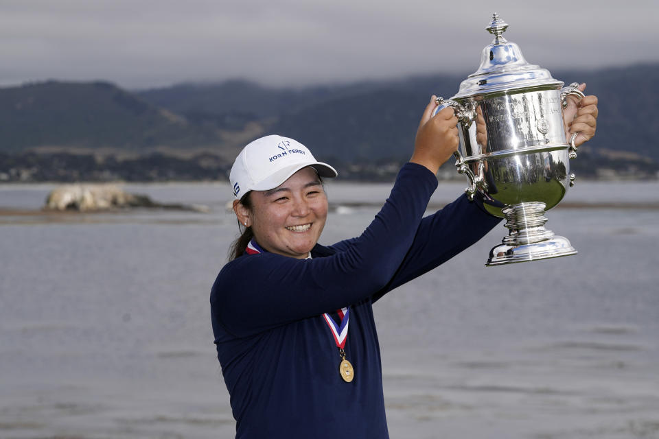 Allisen Corpuz poses with the winner's trophy after the U.S. Women's Open golf tournament at the Pebble Beach Golf Links, Sunday, July 9, 2023, in Pebble Beach, Calif. (AP Photo/Darron Cummings)