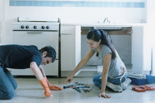 Couple Working in Kitchen