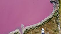 Aerial view of Corfo lagoon that has turned a striking shade of pink as a result of what local environmentalists are attributing to increased pollution from a nearby industrial park, in Trelew, Chubut province, Argentina, Thursday July 29, 2021. (AP Photo/Daniel Feldman)