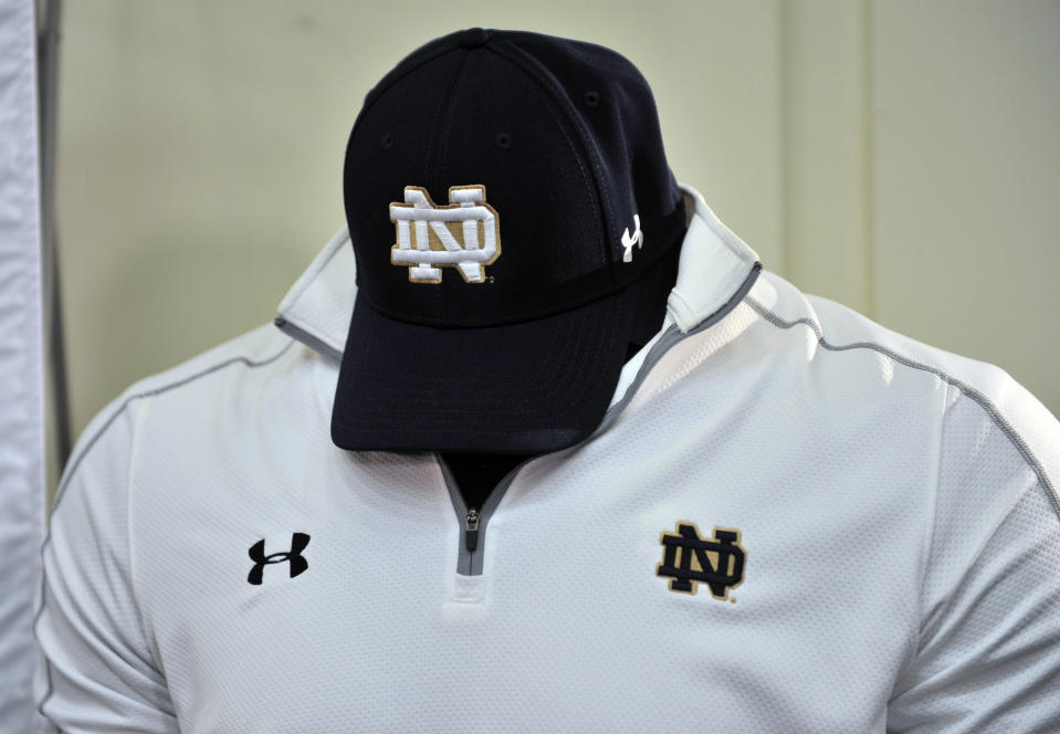 New Notre Dame coaching gear is displayed at a news conference Tuesday Jan. 21, 2014, in South Bend, Ind., announcing an agreement between Notre Dame and Under Armour that will outfit the university's athletic teams (AP Photo/Joe Raymond)