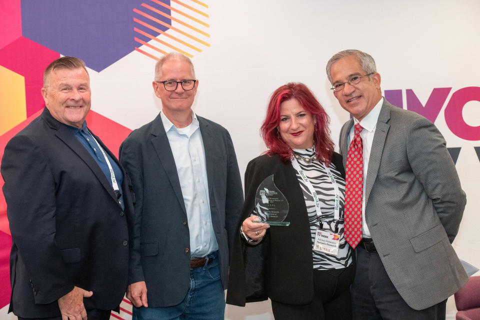 (From l.): Joe Schramm, Schramm Marketing Group; Kent Gibbons, content director, B+C, Multichannel News and Next TV; Adriana Waterston, accepting the Rafael Eli Award for Corporate Pioneer in Hispanic TV on behalf of Horowitz Associates; and Joe Torres, anchor, WABC New York.