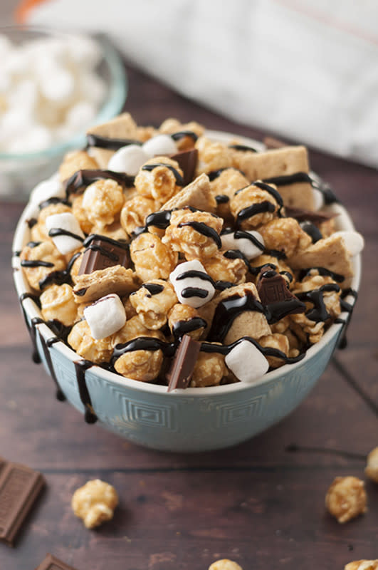 <p>Wishes and Dishes</p><p>The perfect snack for a summertime movie night.</p><p><strong>Get the recipe: <a href="http://wishesndishes.com/caramel-smores-popcorn/" rel="nofollow noopener" target="_blank" data-ylk="slk:Caramel S'mores Popcorn;elm:context_link;itc:0;sec:content-canvas" class="link ">Caramel S'mores Popcorn</a></strong></p><p><strong>Related: <a href="https://parade.com/1198184/alison-ashton/jeff-mauros-salty-sweet-and-decadent-popcorn/" rel="nofollow noopener" target="_blank" data-ylk="slk:Salty, Sweet and Decadent Popcorn;elm:context_link;itc:0;sec:content-canvas" class="link ">Salty, Sweet and Decadent Popcorn</a></strong></p>