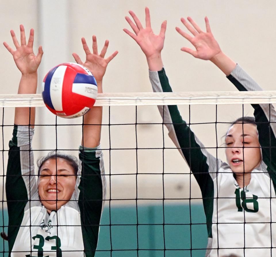 SOUTH YARMOUTH   9/26/22 Vivian Castano (33) and Mariah Eaton of Dennis-Yarmouth block a Sandwich shot.