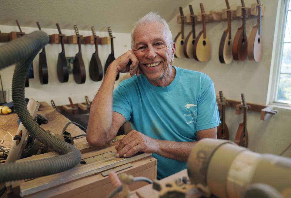 Mike Dulak sits for a portrait in his mandolin workshop in Rocheport, Mo., Friday, Sept. 8, 2023. Dulak does not associate with any religious group and self-identifies as "nothing in particular" when asked about his beliefs. He is part of the largest growing group of nonbelievers in the United States today, as nearly one in six adults claim the label "nothing in particular" according to the Associated Press- NORC Center for Public Affairs Research. (AP Photo/Jessie Wardarski)