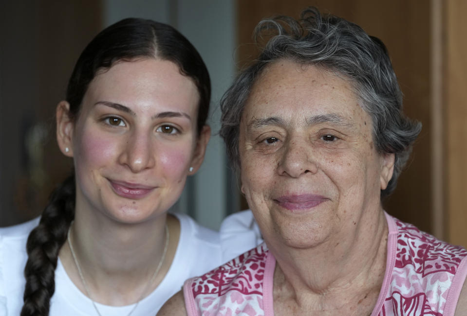 Nonna Rewzina, right, and her granddaughter Lana Solovej, left, pose for a photo after an interview with the Associated Press in Berlin, Germany, Sunday, Aug. 15, 2021. The Conference on Jewish Material Claims Against Germany organization that handles claims on behalf of Jews who suffered under the Nazis says Germany has agreed to extend compensation to Jewish survivors who endured the World War II siege of Leningrad and two other groups who had so far not received any monthly pensions. (AP Photo/Michael Sohn)