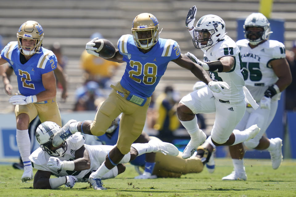 UCLA Bruins running back Brittain Brown (28) runs the ball during the first half of an NCAA college football game against the Hawaii Warriors Saturday, Aug. 28, 2021, in Pasadena, Calif. (AP Photo/Ashley Landis)