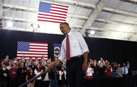 U.S. President Barack Obama steps from the platform after speaking at North Carolina State University in Raleigh January 15, 2014. REUTERS/Kevin Lamarque