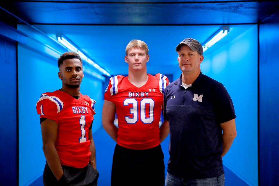 Braylin Presley, left, and Jack Puckett of Bixby pose for a portrait with Marlow coach Matt Weber for all-state football in Oklahoma City, Thursday, Dec. 30, 2021. 