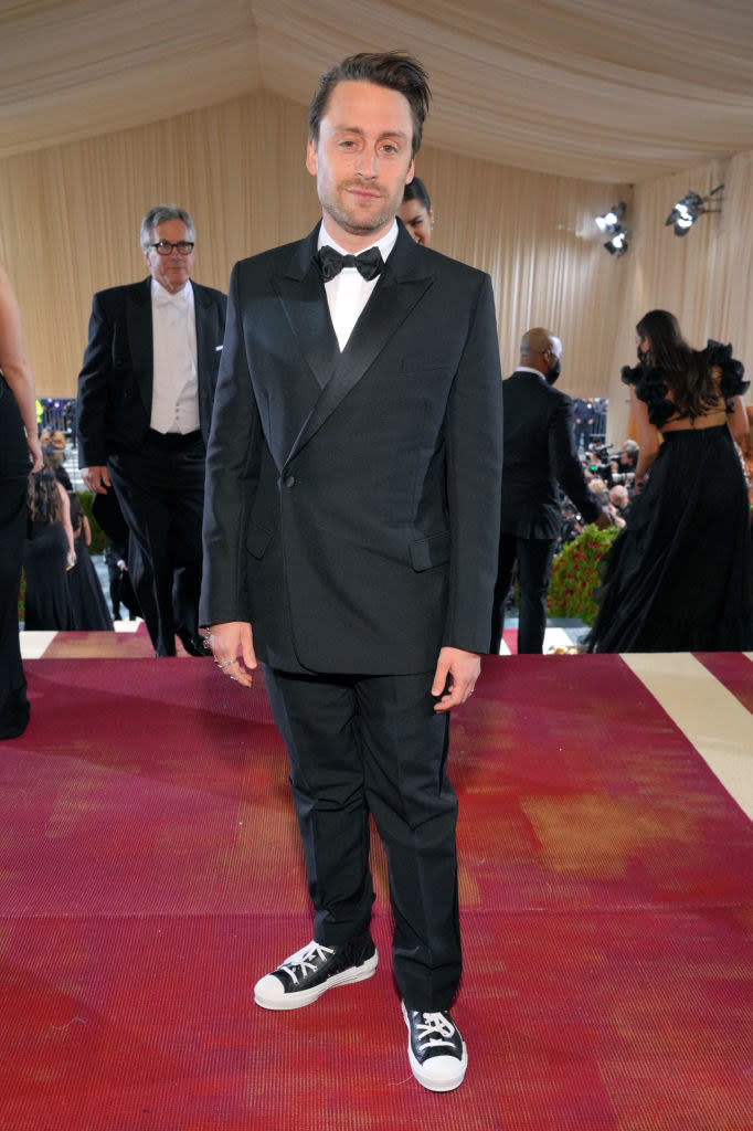 Kieran in a bow tie and sneakers on the red carpet