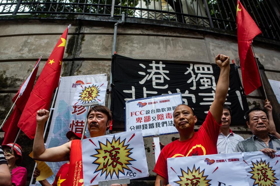 Pro-Beijing protesters chant slogans against pro-independence activist Andy Chan, who is scheduled to make a speech at the Foreign Correspondents' Club (FCC), in Hong Kong on August 14, 2018.