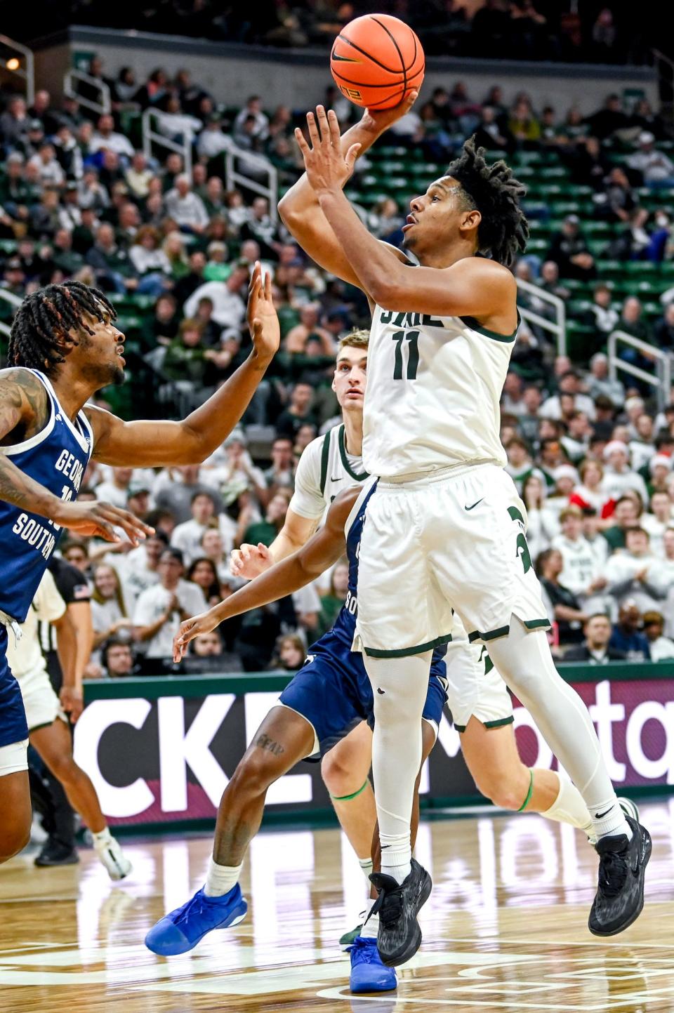 Michigan State's A.J. Hoggard, right, scores as Georgia Southern's Carlos Curry defends during the second half on Tuesday, Nov. 28, 2023, at the Breslin Center in East Lansing.