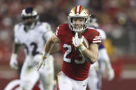 FILE - San Francisco 49ers running back Christian McCaffrey (23) runs against the Baltimore Ravens during the first half of an NFL football game in Santa Clara, Calif., Dec. 25, 2023. McCaffrey ran away with the AP Offensive Player of the Year award announced at NFL Honors on Thursday night, Feb. 8. (AP Photo/Jed Jacobsohn, File)