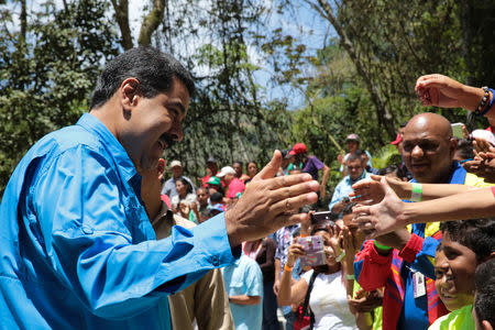 Venezuela's President Nicolas Maduro greets supporters during his weekly broadcast "Los Domingos con Maduro" (The Sundays with Maduro) in Caracas, Venezuela April 2, 2017. Miraflores Palace/Handout via REUTERS