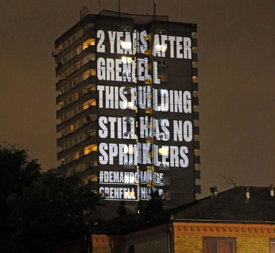 A sprinkler warning was beamed onto a building close to Grenfell Tower last week (Nigel Howard)