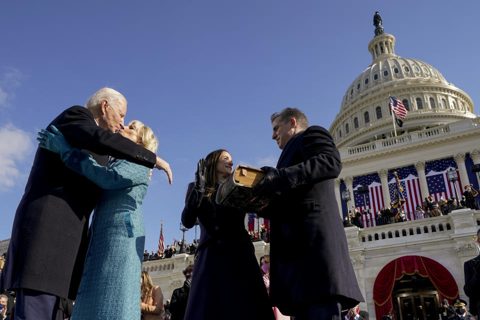 President Joe Biden and first lady Jill Biden, kiss as his son Hunter Biden and daughter Ashley Biden look on after being sworn-in during the 59th Presidential Inauguration at the U.S. Capitol in Washington, Wednesday, Jan. 20, 2021. (AP Photo/Andrew Harnik, Pool)