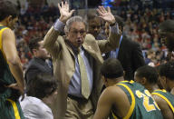 FILE - In this Monday, Jan. 21, 2008, file photo, San Francisco basketball coach Eddie Sutton talks with his team in the first half of an NCAA college basketball game against Gonzaga, in Spokane, Wash. Sutton, the Hall of Fame basketball coach who led three teams to the Final Four and was the first coach to take four schools to the NCAA Tournament, died Saturday, May 23, 2020. He was 84. (AP Photo/Ingrid Barrentine, File)
