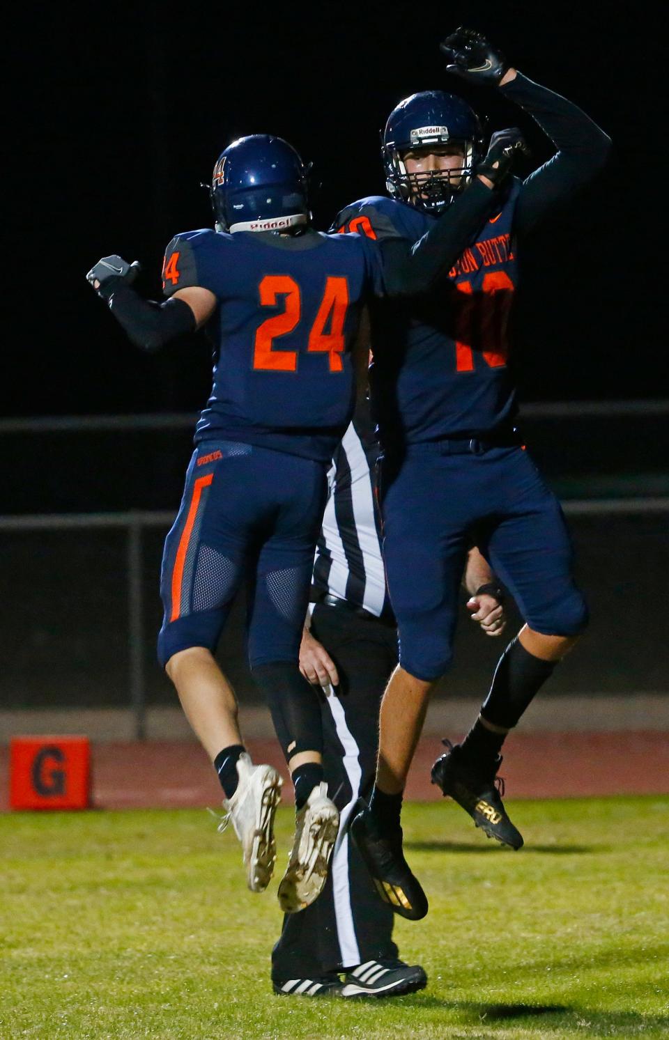 December 3, 2021; San Tan Valley, USA; Poston Butte's Connor Lopez (10) celebrates a touchdown with Josh Furman (24) against Glendale during the 4A Semifinal game at Poston Butte High School. Patrick Breen-Arizona Republic