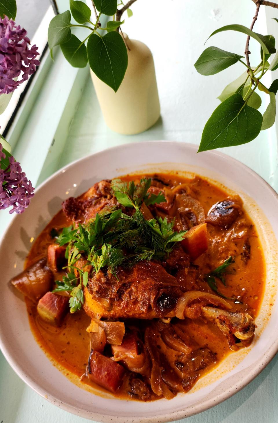 The Pimenton Braised Chicken Quarter is a lunch dish on the menu at Frankie & Laurie's.