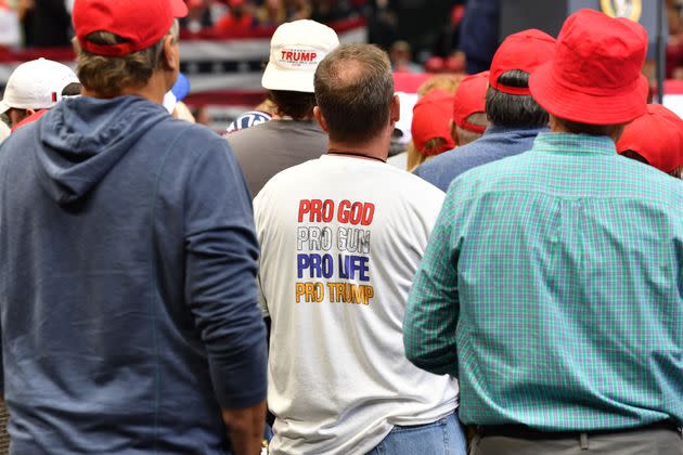 A Trump supporter wears a T-shirt reading 