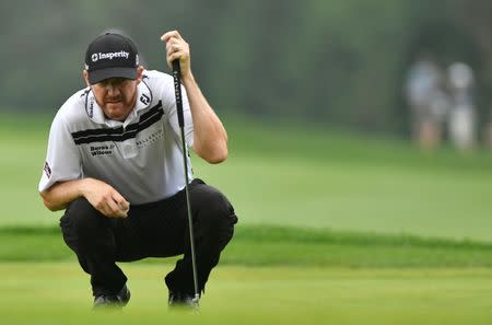 Jul 31, 2016; Springfield, NJ, USA; Jimmy Walker reads a putt on the first hole green during the Sunday round of the 2016 PGA Championship golf tournament at Baltusrol GC - Lower Course. Mandatory Credit: Eric Sucar-USA TODAY Sports