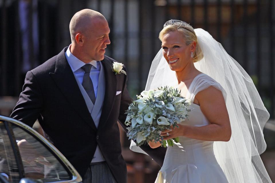 <p>Just a few months later, Zara made it down the aisle herself. She was snapped departing Canongate Kirk in Scotland following her wedding to Mike Tindall, wearing a tiara from her mother, Princess Anne's, collection—the <a href="https://www.townandcountrymag.com/the-scene/weddings/g17805394/royal-wedding-tiaras-throughout-history/?slide=5" rel="nofollow noopener" target="_blank" data-ylk="slk:Meander Tiara;elm:context_link;itc:0;sec:content-canvas" class="link ">Meander Tiara</a>.</p>