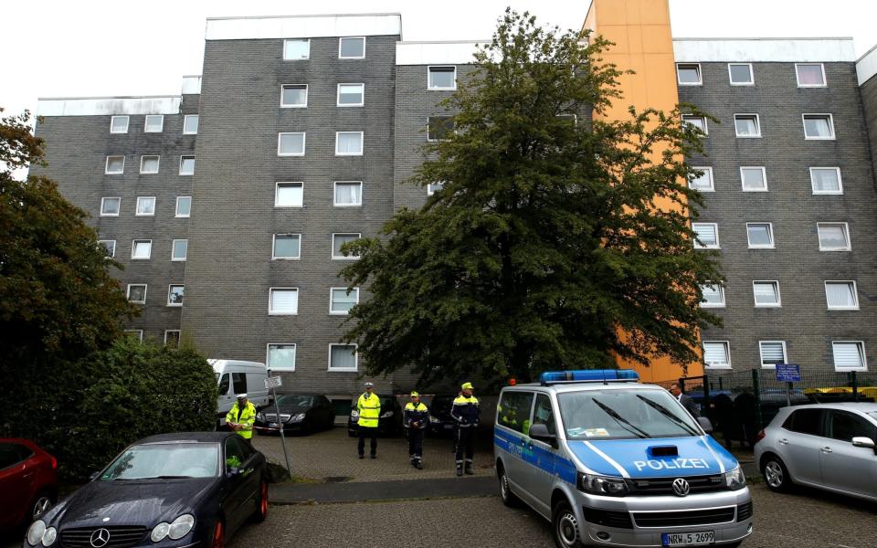 Police have cordoned off the building where the bodies were discovered - THILO SCHMUELGEN /REUTERS