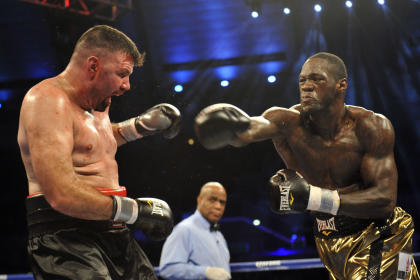 Deontay Wilder (R) roughs up Nicolai Firtha. (USA TODAY Sports)