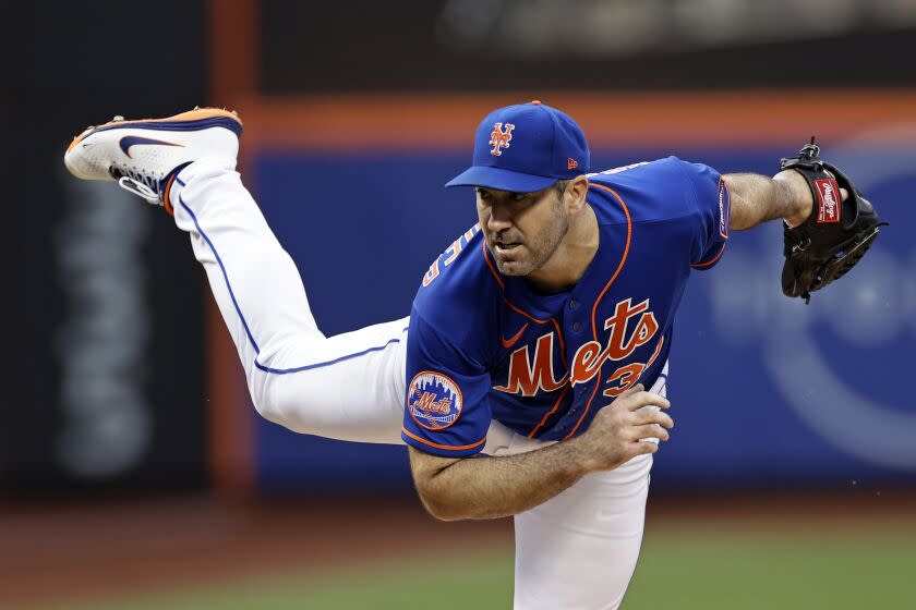 New York Mets pitcher Justin Verlander throws during the first inning of a baseball game.