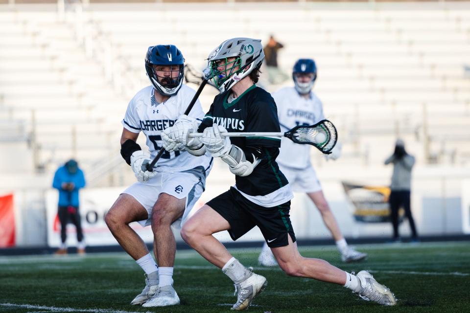 Olympus’ Gage Phippen (11) shoots the ball during a high school boys lacrosse game at Corner Canyon High School in Draper on April 14, 2023. | Ryan Sun, Deseret News