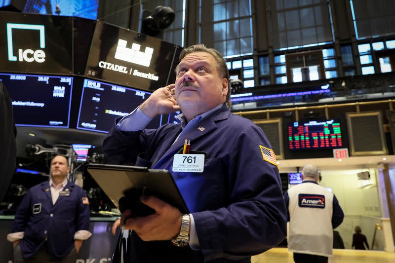 Traders work on the floor of the NYSE in New York