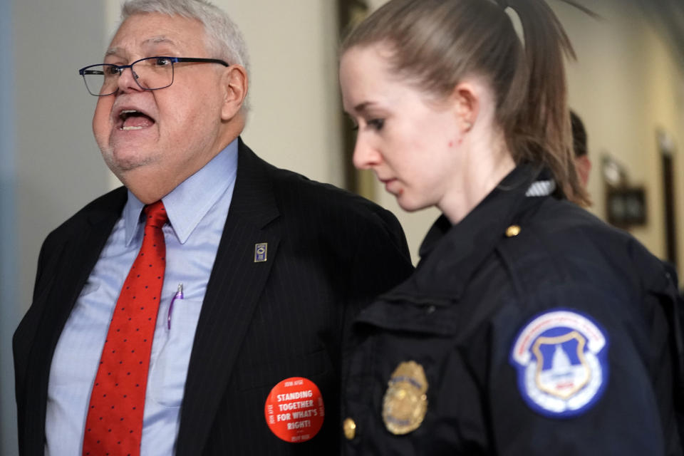 J. David Cox, national president of the AFGE, is led away by U.S. Capitol Police after participating in a protest against the government shutdown outside the Capitol Hill office of Senate Majority Leader Sen. Mitch McConnell, R-Ky., on Jan. 23, 2019. (Photo: Alex Wong/Getty Images)