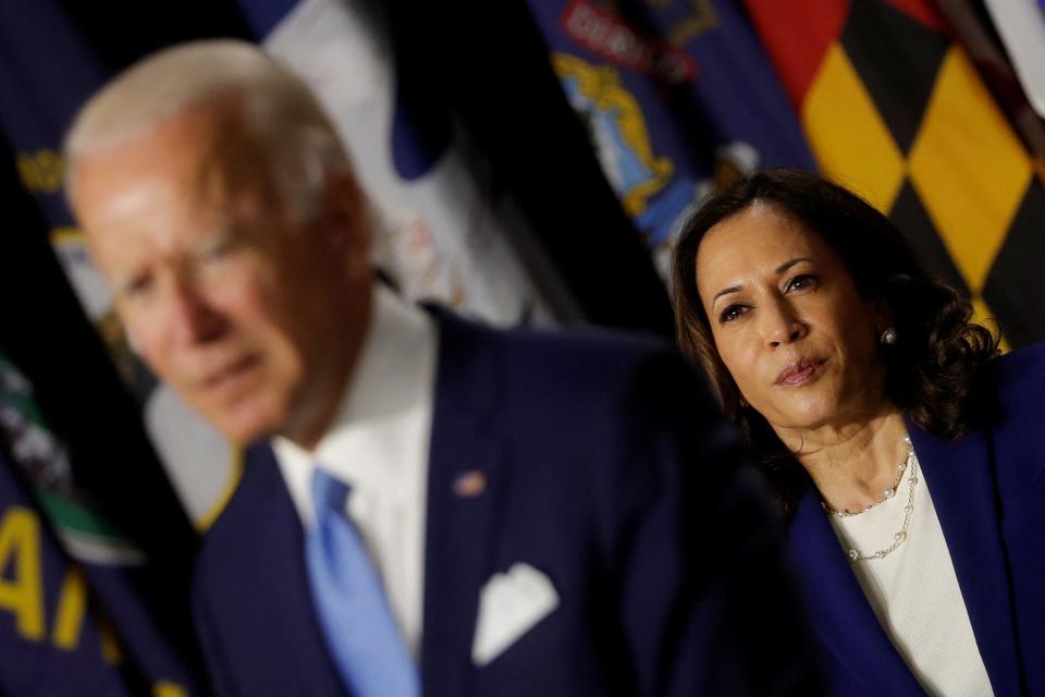 Democratic vice presidential candidate Senator Kamala Harris looks on as Democratic presidential candidate and former Vice President Joe Biden speaks at a campaign event, their first joint appearance since Biden named Harris as his running mate, at Alexis Dupont High School in Wilmington, Delaware, U.S., August 12, 2020.