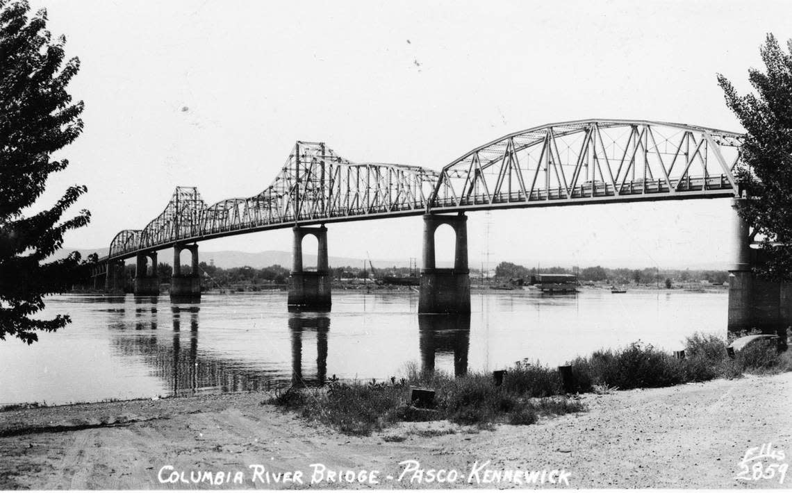 A 1948 view of the former green bridge, which was built in 1922 between Kennewick and Pasco. A sign posted on the bridge declared Kennewick a sundown town with Blacks not allowed after sunset.