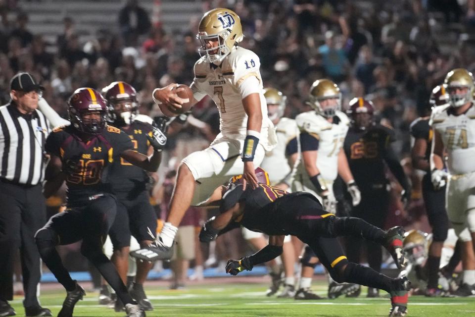 Desert Vista quarterback Braxton Thomas (7) leaps into the end zone for a touchdown against Mountain Pointe on Thursday, Sept. 29, 2022. 