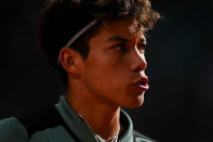 Darwin Blanch of United States competes against Rafael Nadal of Spain during the Mutua Madrid Open tennis tournament in Madrid, Thursday, April 25, 2024. (AP Photo/Manu Fernandez)