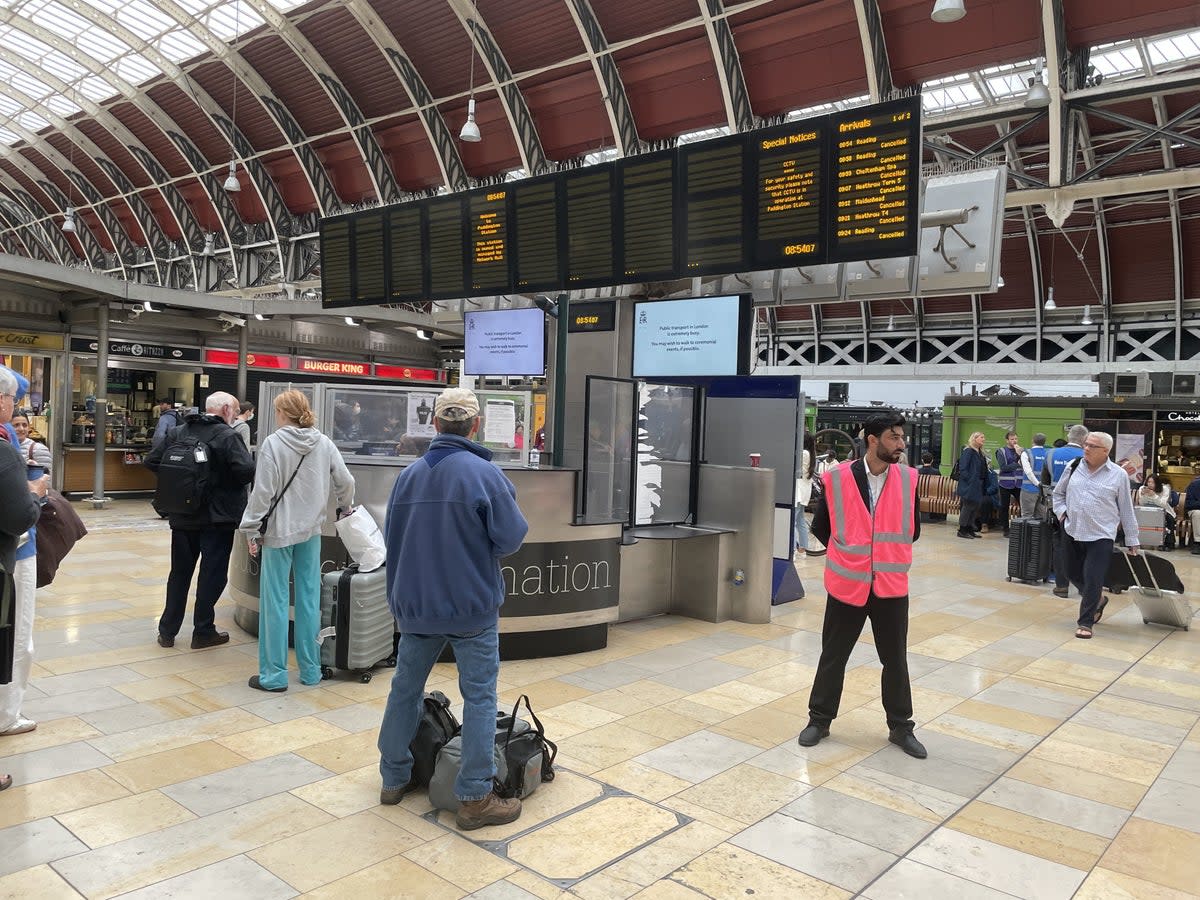 Members of the public look at the travel boards in Paddington Station, London, as all railway lines between Slough and Paddington are blocked due to damage to overhead electric wire (Margaret Davis/PA) (PA Wire)