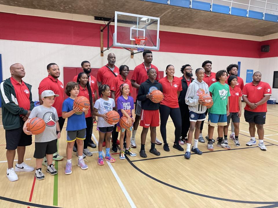 Miami Heat center Thomas Bryant and his coaching staff takes photo with the Campers of the Week when the Thomas Bryant Basketball Camp concluded Friday, Aug. 25 YMCA of Greater Rochester.