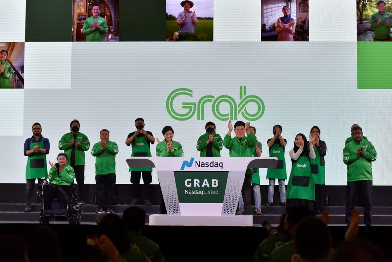 Grab's CEO Anthony Tan and co-founder Tan Hooi Ling at the Grab Bell Ringing Ceremony at a hotel in Singapore