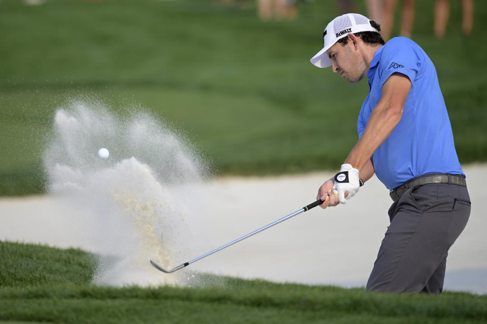 Patrick Cantlay hits from a bunker onto the 14th green during the first round of the Arnold Palmer Invitational golf tournament, Thursday, March 2, 2023, in Orlando, Fla. (AP Photo/Phelan M. Ebenhack)