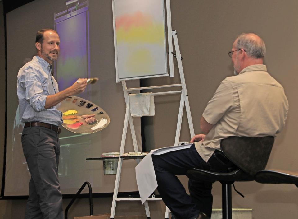 Nicholas Hankins chats about his life and paints live in front of an audience with Greg Holbrook, executive director of the New Smyrna Museum of History, during the The Joy Continues event, Thursday, April 4, 2024.