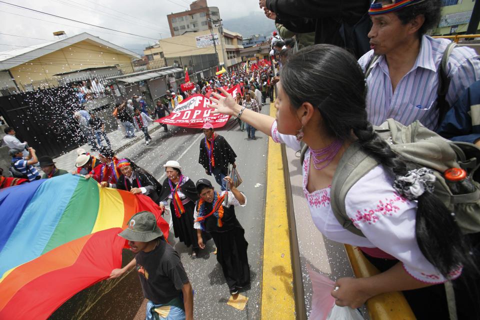 Indigenous people march to protest President Rafael Correa's policies on mining in Quito, Ecuador, Thursday, March 22, 2012. Protesters reached Ecuador's capital on Thursday after a two-week march from the Amazon to oppose plans for large-scaling mining projects on their lands. (AP Photo/Dolores Ochoa)