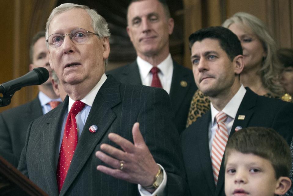 Senate Majority Leader Mitch McConnell of Ky., speaks on Capitol in Washington, Thursday, Dec. 8, 2016, during the signing ceremony for the 21st Century Cures Act. From left are, McConnell, Rep. Tim Murphy, R-Pa., House Speaker Paul Ryan of Wis., and Max Schill, 7, who suffers from Noonan Syndrome. (AP Photo/Cliff Owen)