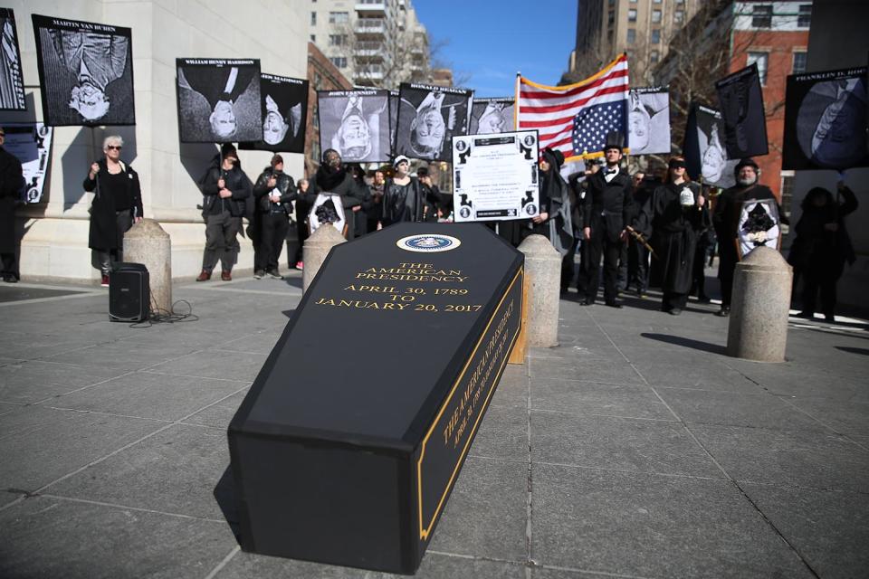 <p>A coffin is propped up under the Arch during the “A Mock Funeral for President’s Day” rally at Washington Square Park in New York City on Feb. 18, 2017. (Gordon Donovan/Yahoo News) </p>