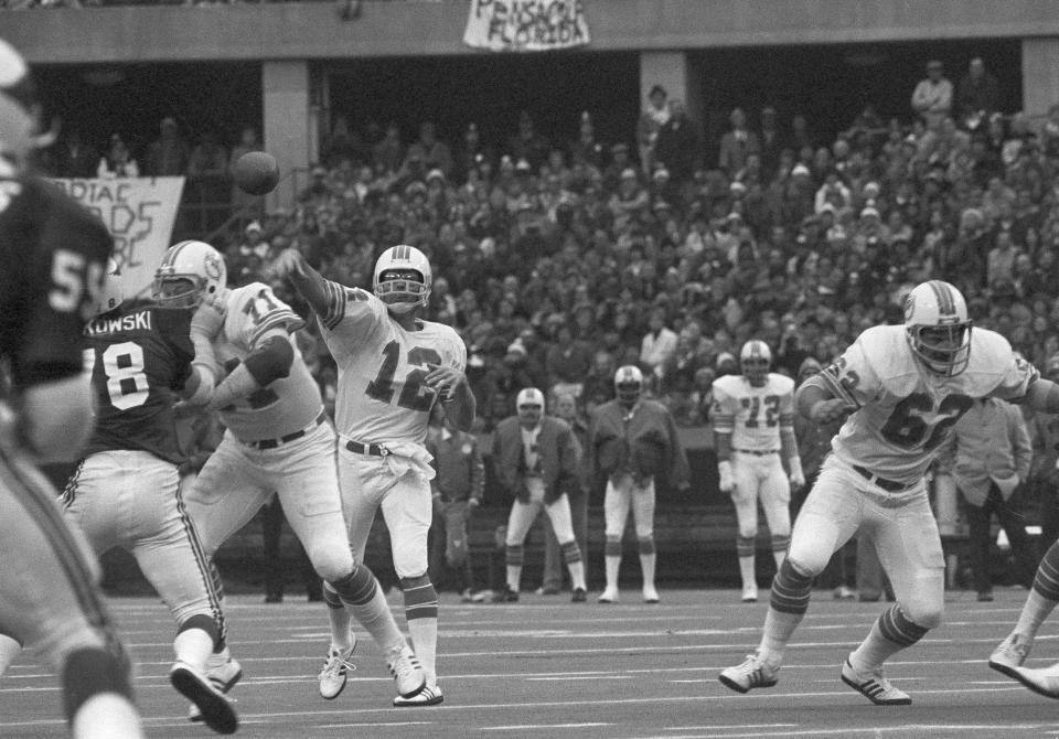 Miami Dolphins quarterback Bob Griese (12) in action during game against the St. Louis Cardinals at St. Louis, Nov. 24, 1977. (AP Photo)