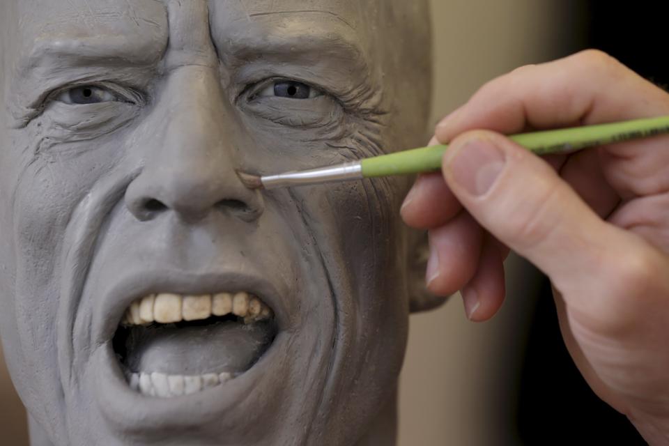 Paris' Grevin Wax Museum sculptor Eric Saint Chaffray works on the head of Rolling Stones lead singer Mick Jagger