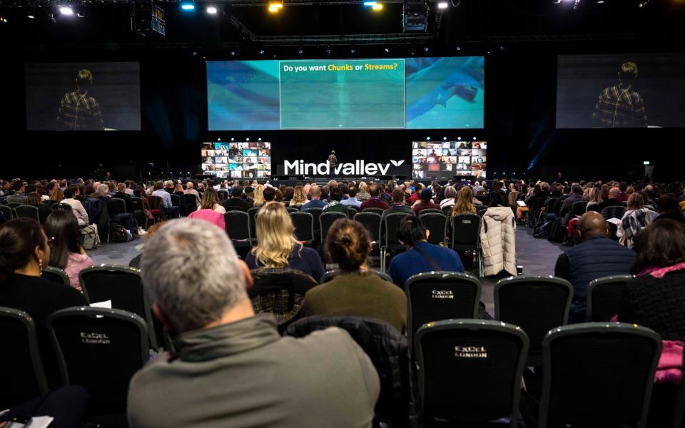 A view from the back of the room at the Excel centre that shows the packed audience