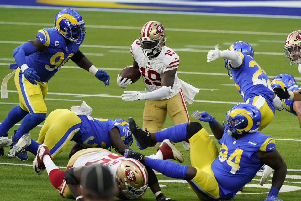 San Francisco 49ers wide receiver Deebo Samuel (19) carries against the Los Angeles Rams during the first half of an NFL football game Sunday, Nov. 29, 2020, in Inglewood, Calif. (AP Photo/Alex Gallardo)