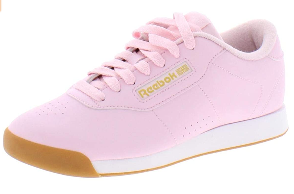 pink lace up sneaker with gold sole. 