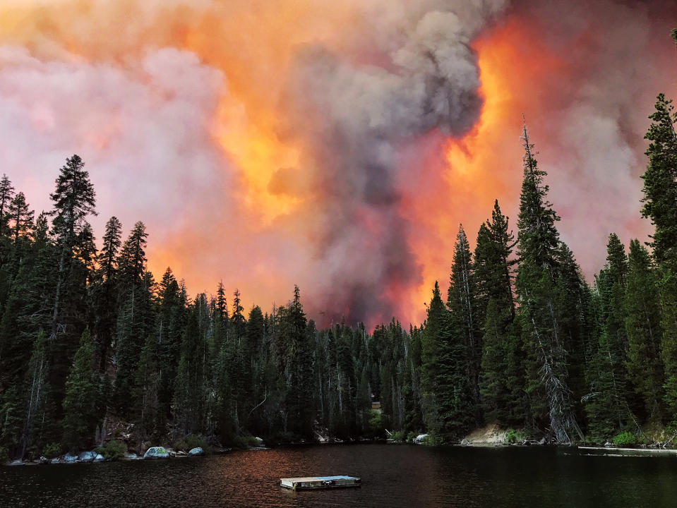 Smoke from the Creek Fire billows beyond a ridge as seen from Huntington Lake on Saturday, Sept. 5, 2020, at Huntington Lake, Calif. (Eric Paul Zamora/The Fresno Bee via AP)