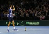 Tennis - Great Britain v United States of America - Davis Cup World Group First Round - Emirates Arena, Glasgow, Scotland - 6/3/15 Great Britain's James Ward throws this racquet down as he celebrates victory Action Images via Reuters / Andrew Boyers Livepic